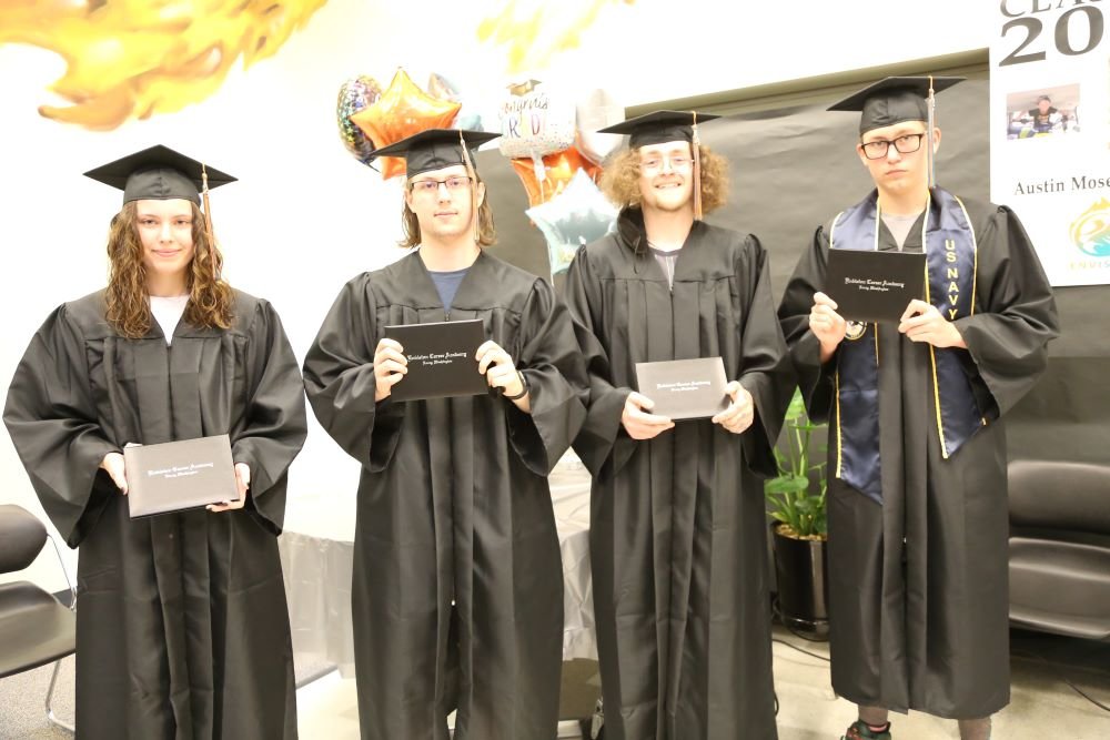 This image shows Kaleena Pierce, Austin Moser-Attaway, Ryan Spiva, Clifford Kettle who graduated in June 2021 from Envision Career Academy of North Thurston Public Schools. Not pictured: Karina Herrera.